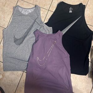 3 Nike Tank Tops in Gray, Purple, and Black